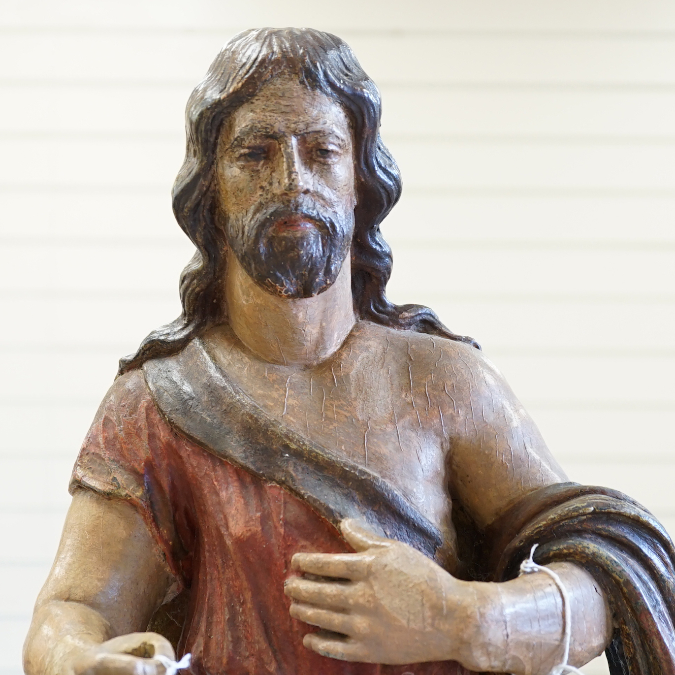An antique carved and painted wood figure of Christ with a sheep, 69cm high